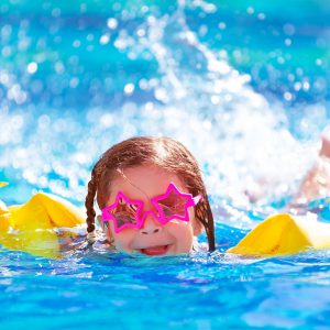 Girl swimming in a pool in Perth