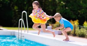 kids-jumping-into-a-pool